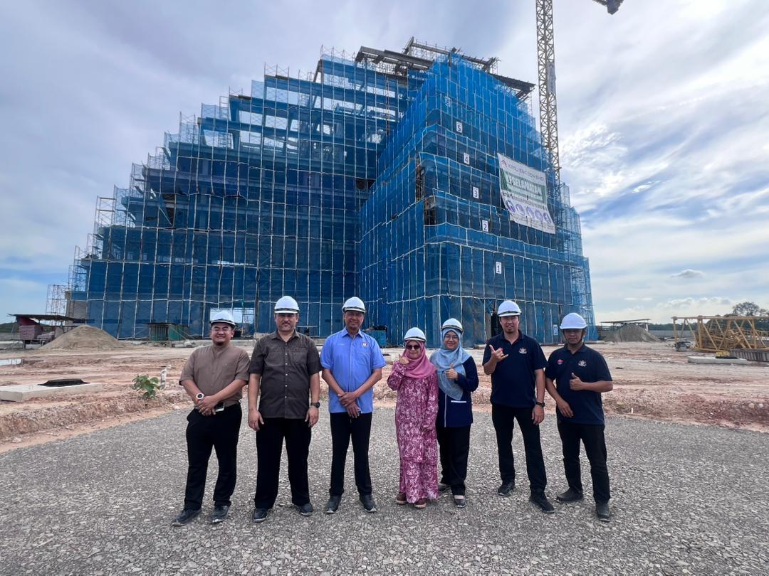 Avancer site-engagement team in front of a building under construction